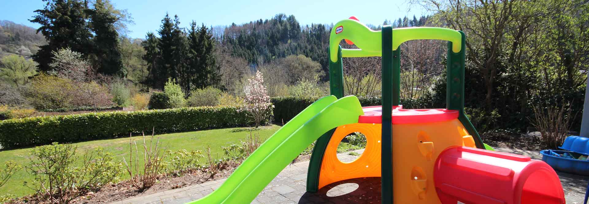 Climbing frame with slide